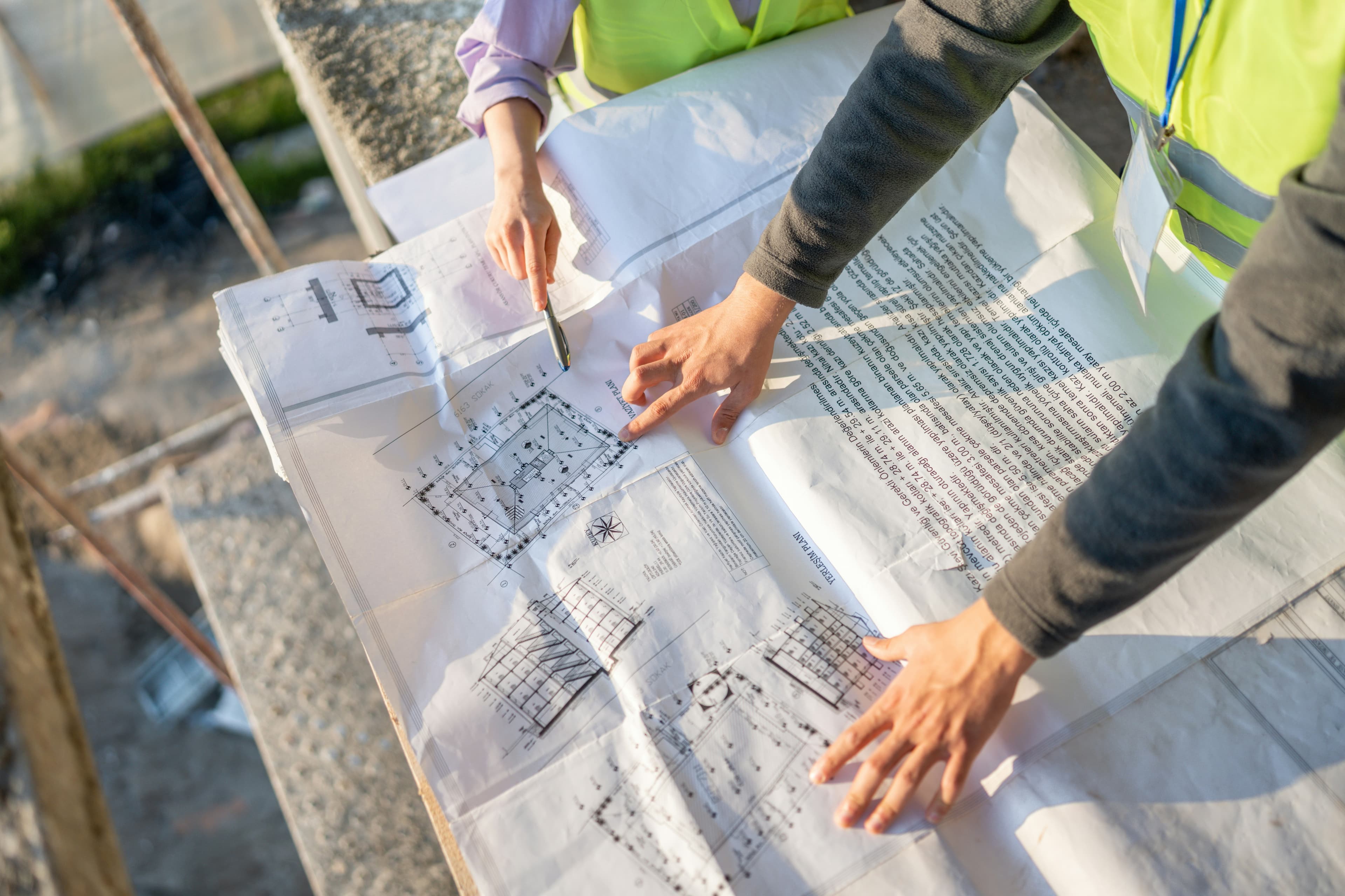 Construction planning session with blueprints